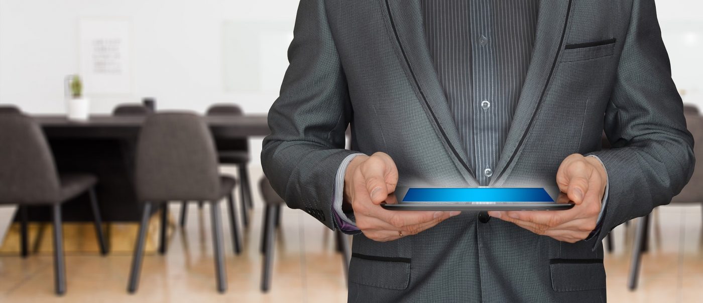 Man holding a wireless device whose signal has been boosted